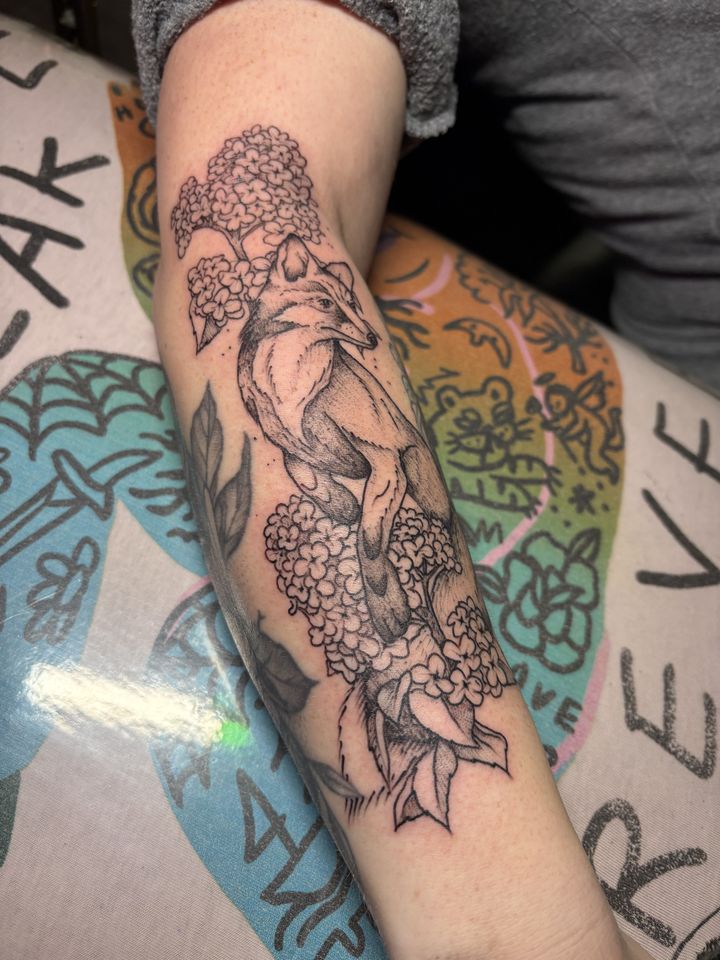 Fox with lilacs, forearm, tattoo by Lisa Loewen at Stingray Tattoo, Regina